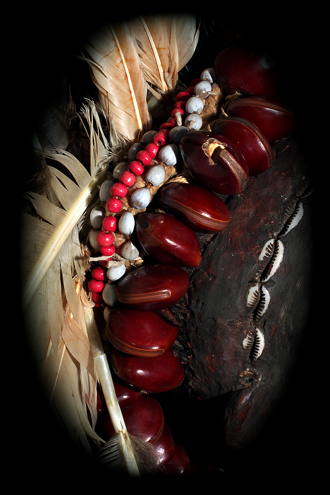 ASMAT ANCESTOR SKULL BEADS, SHELL, FEATHERS, AND SEEDS