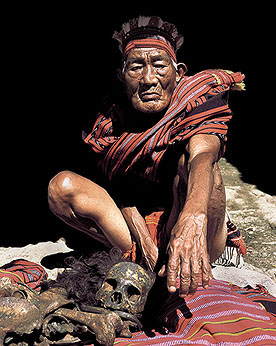 IFUGAO ELDER WITH BONES OF THIS FATHER